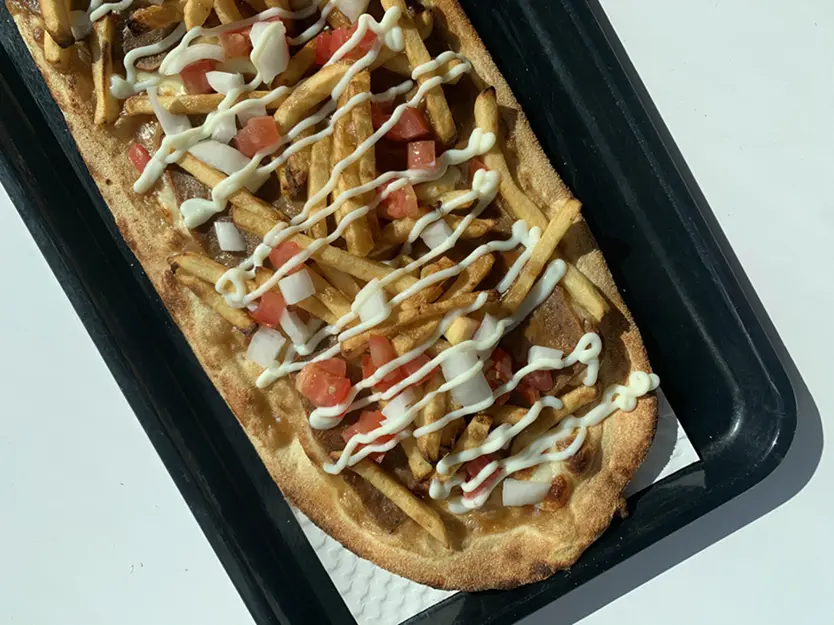 Donair Poutizza with seasoned beef and sweet sauce